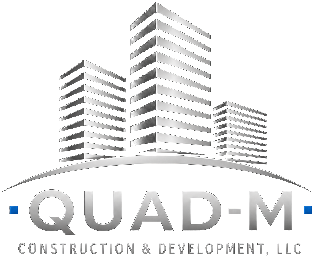 Quad-M Construction & Development logo